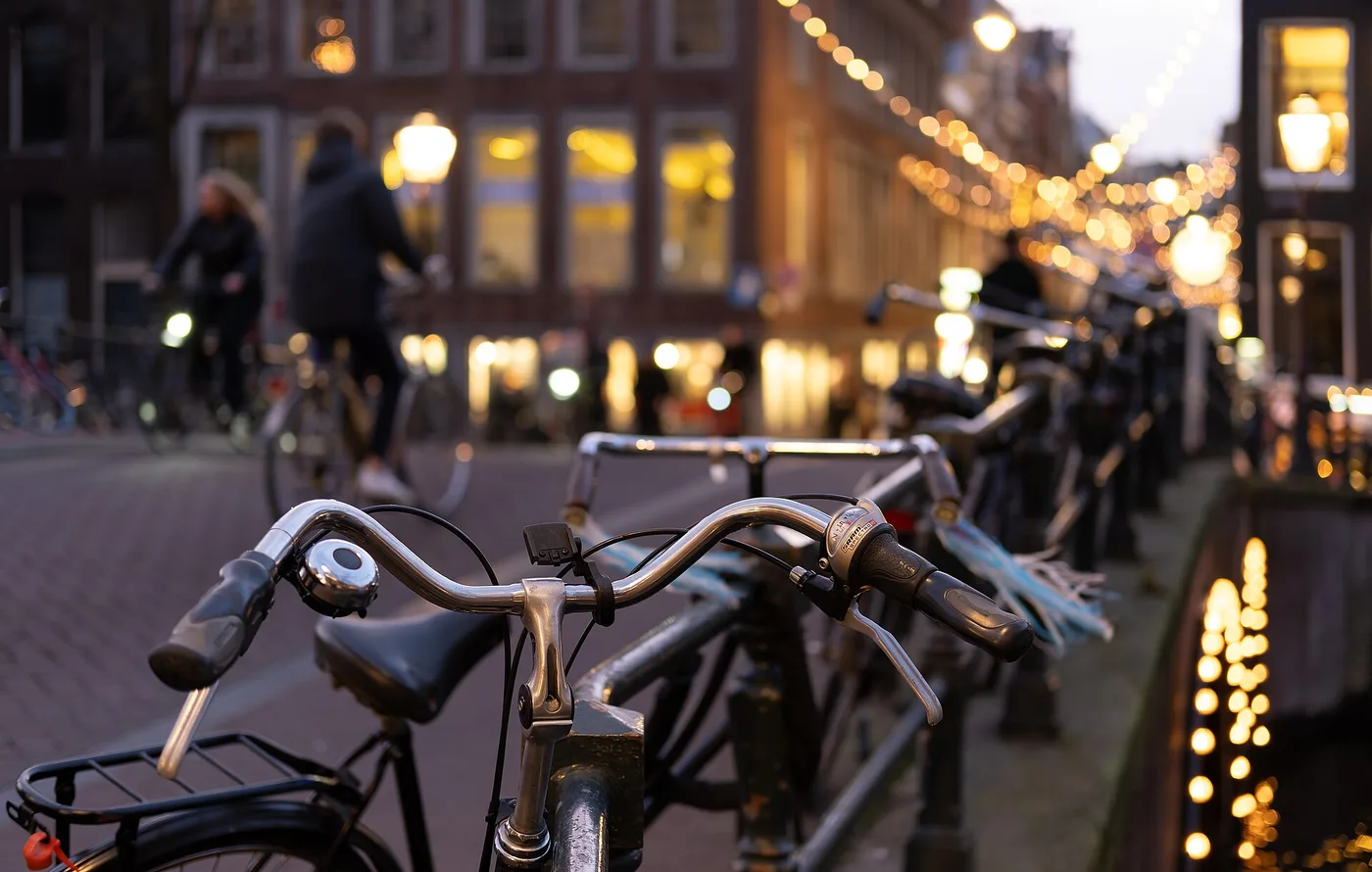 Bicycle leaning against a bridge railing, Berenstraat, Amsterdam, Netherlands julesvernex2