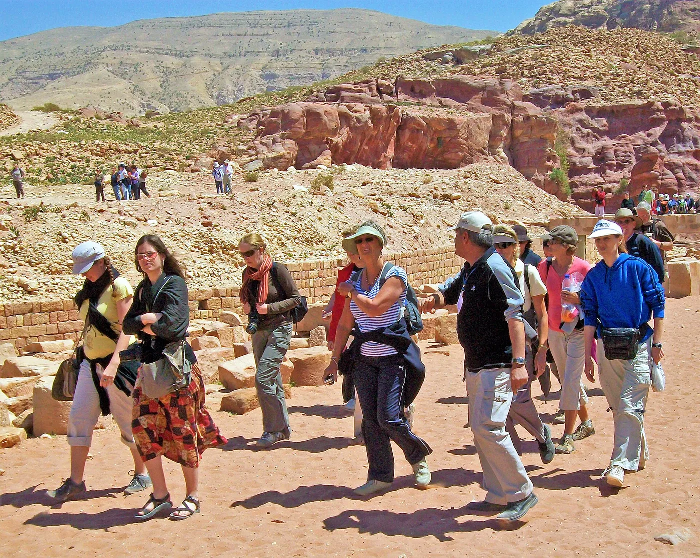 Tourists with guide in lower canyon, Petra